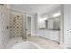 Well-lit bathroom offers tile flooring, walk-in shower and double sink vanity at 8170 Bay Pointe Dr, Denver, NC 28037