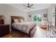 Bedroom with wood floors, large window, and armchair at 8170 Bay Pointe Dr, Denver, NC 28037