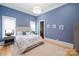 Blue bedroom with bed, side tables, rug, and elegant decor at 8170 Bay Pointe Dr, Denver, NC 28037