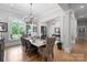 Bright dining room featuring hardwood floors, chandelier lighting and a window overlooking the grounds at 8170 Bay Pointe Dr, Denver, NC 28037
