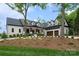 Striking home with dormers, a 3-car garage, and a manicured front yard creating exceptional curb appeal at 8170 Bay Pointe Dr, Denver, NC 28037