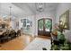 Elegant foyer showcasing hardwood floors, chandelier lighting and stylish console table at 8170 Bay Pointe Dr, Denver, NC 28037