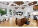 Modern kitchen with a large island, stainless steel appliances, and an open layout leading to an outdoor patio at 8170 Bay Pointe Dr, Denver, NC 28037