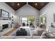 Bright living room with built-in shelves, fireplace and sliding glass doors with lake views at 8170 Bay Pointe Dr, Denver, NC 28037