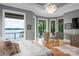 Relax in this main bedroom with access to the outdoors and water views at 8170 Bay Pointe Dr, Denver, NC 28037