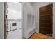 Mudroom with white cabinetry, bench seating, and storage at 8170 Bay Pointe Dr, Denver, NC 28037
