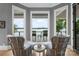 This sitting area features comfortable seating and access to the outdoor spaces at 8170 Bay Pointe Dr, Denver, NC 28037