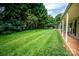 Expansive backyard with lush green grass and mature trees offering a tranquil setting at 899 Wendover Rd # 29, Statesville, NC 28677