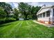 Backyard of home features lush lawn and mature trees at 899 Wendover Rd # 29, Statesville, NC 28677