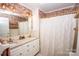 Updated bathroom featuring double sinks, decorative wallpaper, and stylish fixtures at 899 Wendover Rd # 29, Statesville, NC 28677