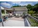 Outdoor deck features comfortable seating, an umbrella, and a table at 899 Wendover Rd # 29, Statesville, NC 28677