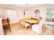 Cozy dining area featuring a stylish light fixture, dining table set for four, and views of the front yard at 899 Wendover Rd # 29, Statesville, NC 28677