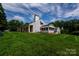 Exterior shot of home featuring a well-maintained yard and charming front porch at 899 Wendover Rd # 29, Statesville, NC 28677