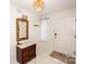 Bright foyer featuring an ornate mirror, wooden accent furniture, stylish lighting fixture, and marble-patterned floors at 899 Wendover Rd # 29, Statesville, NC 28677