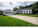 Charming single-story home with a well-manicured lawn, long driveway, and a detached two-car garage at 899 Wendover Rd # 29, Statesville, NC 28677