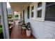 Inviting front porch with a decorative tile floor, comfortable seating, and views of the landscaped front yard at 899 Wendover Rd # 29, Statesville, NC 28677