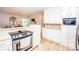 Open kitchen with ample cabinet space, modern appliances, and seamless flow into the adjacent dining area at 899 Wendover Rd # 29, Statesville, NC 28677