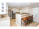 Spacious kitchen with a breakfast bar, stainless steel appliances, and ample counter space for food preparation at 899 Wendover Rd # 29, Statesville, NC 28677