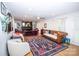 Comfortable living room featuring hardwood floors, a fireplace, and a decorative rug at 899 Wendover Rd # 29, Statesville, NC 28677