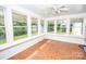 Sunny sunroom offering views of the backyard, light neutral interior, and ceramic tile flooring at 899 Wendover Rd # 29, Statesville, NC 28677