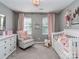 Charming Bedroom with soft colors and a decorative chandelier at 9422 Olivia Ln, Charlotte, NC 28277