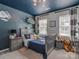 bedroom with Star Wars theme, plush toys, and carpeted flooring at 9422 Olivia Ln, Charlotte, NC 28277