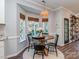 Charming breakfast nook with bright windows and a stylish pendant light at 9422 Olivia Ln, Charlotte, NC 28277