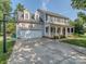 Traditional two-story home with a spacious driveway, two-car garage, and inviting front porch at 9422 Olivia Ln, Charlotte, NC 28277
