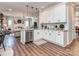 Modern kitchen with white cabinets, stainless steel appliances, and an open layout at 9422 Olivia Ln, Charlotte, NC 28277