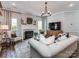 Elegant living room featuring a fireplace and a large-screen television at 9422 Olivia Ln, Charlotte, NC 28277