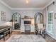 Elegant home office with a desk, stylish decor, and a comfortable seating area at 9422 Olivia Ln, Charlotte, NC 28277