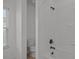 Clean bathroom with white tile shower and a toilet at 9937 Violet Cannon Nw Dr, Concord, NC 28027