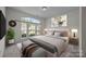 Serene bedroom with a large window providing plenty of natural light at 9937 Violet Cannon Nw Dr, Concord, NC 28027