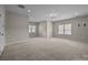 Spacious bonus room with plush carpet, neutral paint and bright, natural light at 9937 Violet Cannon Nw Dr, Concord, NC 28027