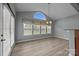 Bright dining room with large windows and a modern chandelier at 9937 Violet Cannon Nw Dr, Concord, NC 28027