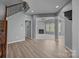 Open living room with a fireplace and ample natural light, perfect for relaxing at 9937 Violet Cannon Nw Dr, Concord, NC 28027