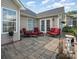 Cozy backyard patio featuring outdoor seating, decorative plants, and French doors at 10211 Dominion Village Dr, Charlotte, NC 28269