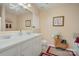 Bright bathroom features double sinks, ample counter space, and decorative mosaic tiling for a modern touch at 10211 Dominion Village Dr, Charlotte, NC 28269