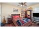 Inviting bedroom with a cozy bed, wooden floors, and ample storage space offering comfort and functionality at 10211 Dominion Village Dr, Charlotte, NC 28269