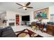 Bright bonus room with cozy seating and a fireplace, offering a comfortable space for work or leisure at 10211 Dominion Village Dr, Charlotte, NC 28269