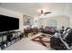 Versatile bonus room with comfortable seating, a large TV, and natural light perfect for relaxation or entertainment at 10211 Dominion Village Dr, Charlotte, NC 28269
