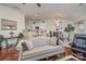 Open living area showcases a comfortable sofa with hardwood floors throughout the home at 10211 Dominion Village Dr, Charlotte, NC 28269