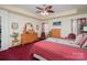 Tranquil main bedroom with a trey ceiling, a ceiling fan, and warm, inviting decor for relaxation at 10211 Dominion Village Dr, Charlotte, NC 28269