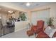 Bright sunroom area with tile floor, seating and natural light at 10211 Dominion Village Dr, Charlotte, NC 28269