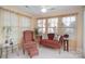Cozy sunroom with ample sunlight and comfortable seating, perfect for relaxation at 10211 Dominion Village Dr, Charlotte, NC 28269