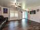 Well-lit living room with hardwood floors and a view into the front yard, creating an open, welcoming atmosphere at 12423 Softwood Ct, Charlotte, NC 28273