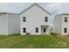Exterior rear view showcasing the backyard and back of the home at 1272 Langston Ln, Salisbury, NC 28144