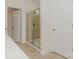 Bathroom featuring a tiled shower with glass door, and tiled floors throughout at 1272 Langston Ln, Salisbury, NC 28144