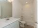 Clean bathroom featuring a stylish vanity with sleek fixtures and a shower-tub combination at 1272 Langston Ln, Salisbury, NC 28144