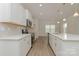 Well-lit kitchen showcasing white cabinets and stainless steel appliances at 1272 Langston Ln, Salisbury, NC 28144
